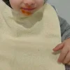 Babero rizo plastico con goma amarillo