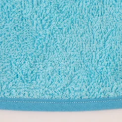 Babero rizo plastico con goma turquesa